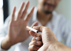 Quit bad habits like smoking to improve your odds of dental implant success