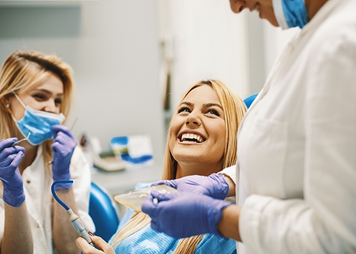 patient smiling and looking at dentist