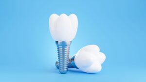 Two dental implants with with a light blue background